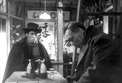 Image from Ikiru showing two men talking at a bar