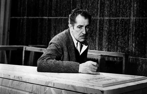 Image from The Last Man On Earth showing an older man sitting at a table